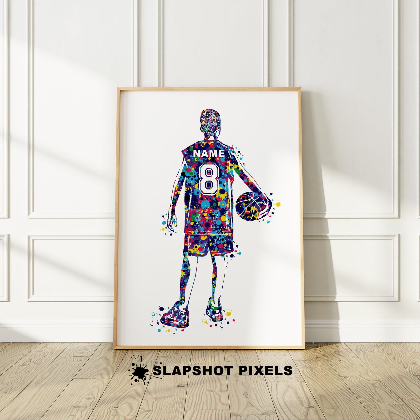 Personalized boy basketball poster showing back of a boy basketball player with custom name and number on the basketball jersey. Designed in watercolor splatters. Perfect basketball gifts for boys, basketball prints, basketball team gifts, basketball coach gift, basketball wall art décor in a basketball bedroom and birthday gifts for basketball players.