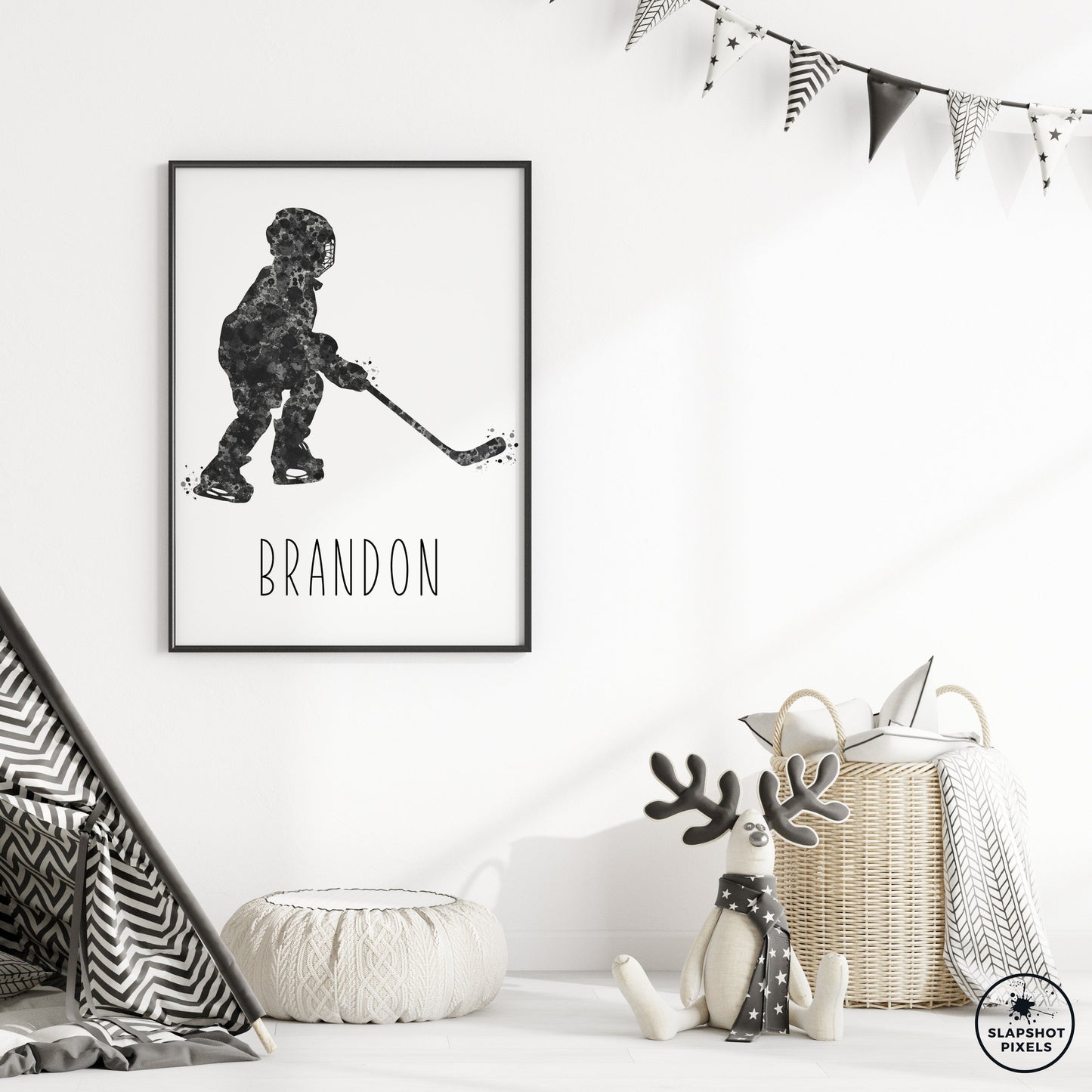 Personalized hockey poster of a child hockey player holding a hockey stick with custom name under the player. Designed in black and grey watercolor splatters. Perfect hockey gifts for boys, hockey team gifts, hockey coach gift, hockey wall art décor in a hockey bedroom and birthday gifts for hockey players.