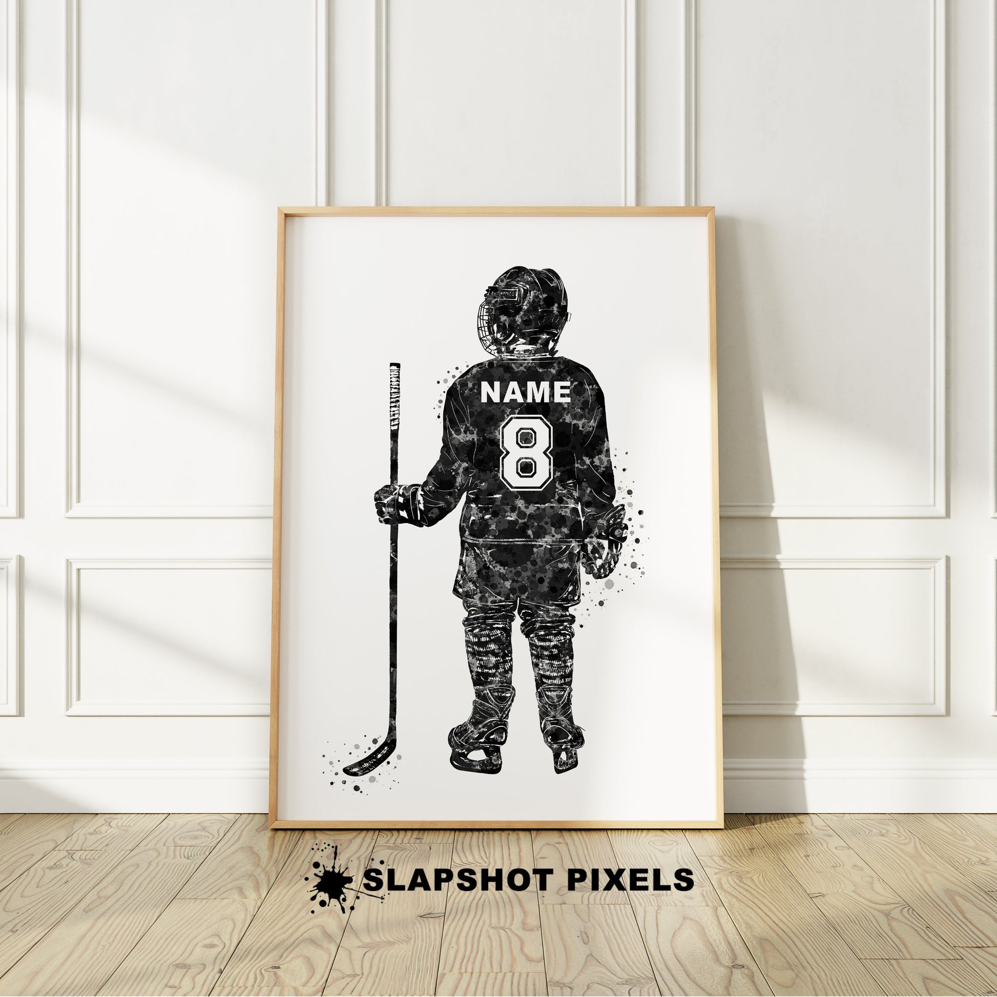 Personalized hockey poster showing back of little boy hockey player with custom name and number on the hockey jersey. Designed in watercolor splatters. Perfect hockey gifts for boys, hockey team gifts, hockey coach gift, hockey wall art décor in a hockey bedroom and birthday gifts for hockey players.