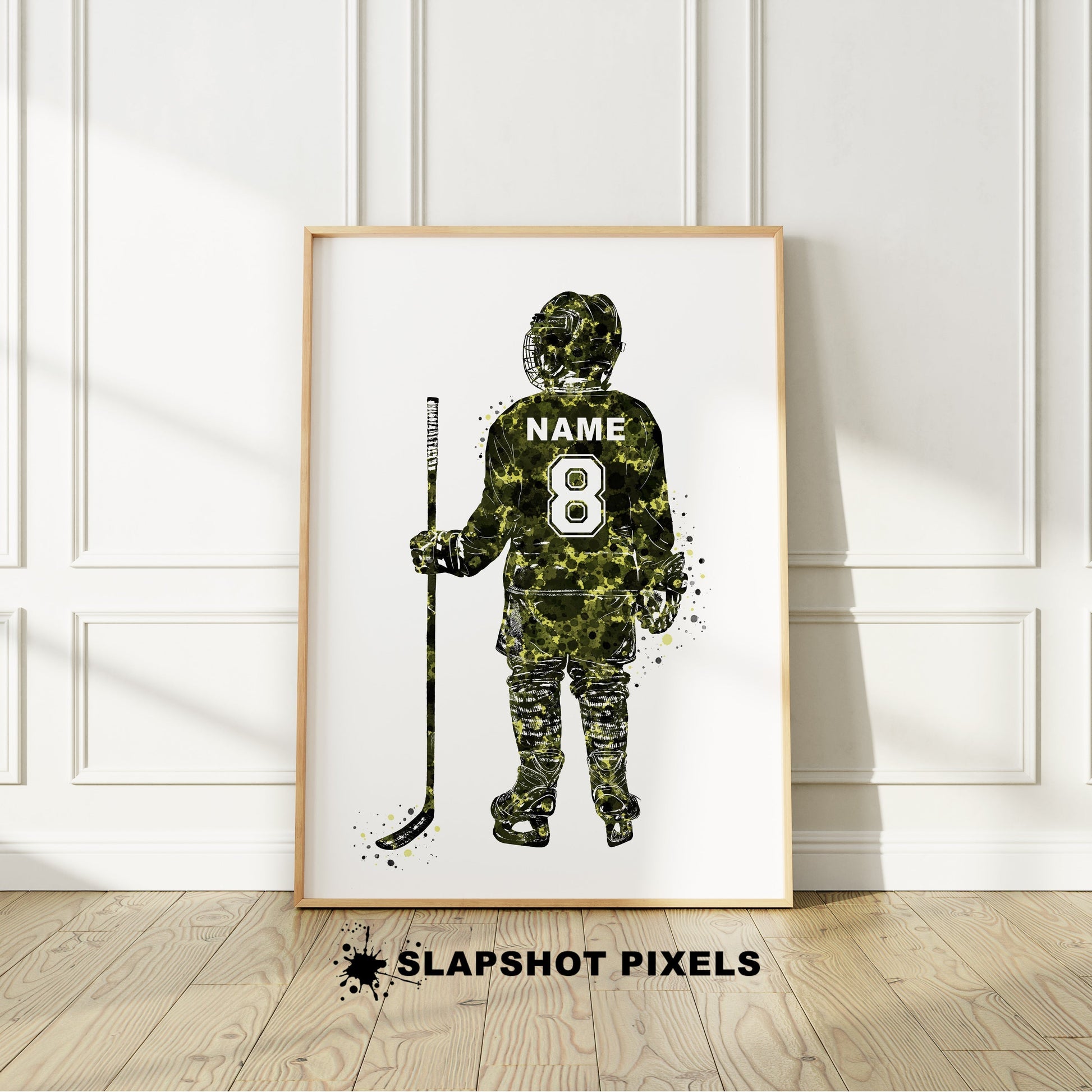 Personalized hockey poster showing back of little boy hockey player with custom name and number on the hockey jersey. Designed in watercolor splatters. Perfect hockey gifts for boys, hockey team gifts, hockey coach gift, hockey wall art décor in a hockey bedroom and birthday gifts for hockey players.