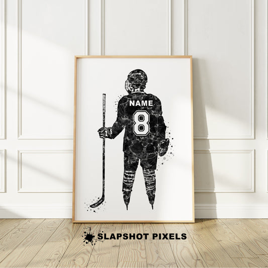 Personalized hockey poster showing back of hockey player with custom name and number on the hockey jersey. Designed in watercolor splatters. Perfect hockey gifts for boys, hockey team gifts, hockey coach gift, hockey wall art décor in a hockey bedroom and birthday gifts for hockey players.