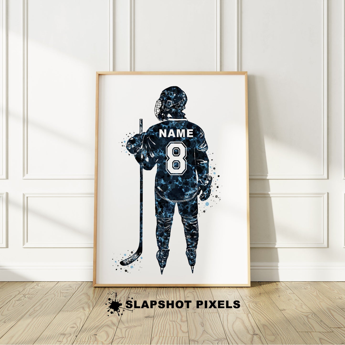 Personalized hockey poster showing back of hockey player with custom name and number on the hockey jersey. Designed in watercolor splatters. Perfect hockey gifts for boys, hockey team gifts, hockey coach gift, hockey wall art décor in a hockey bedroom and birthday gifts for hockey players.