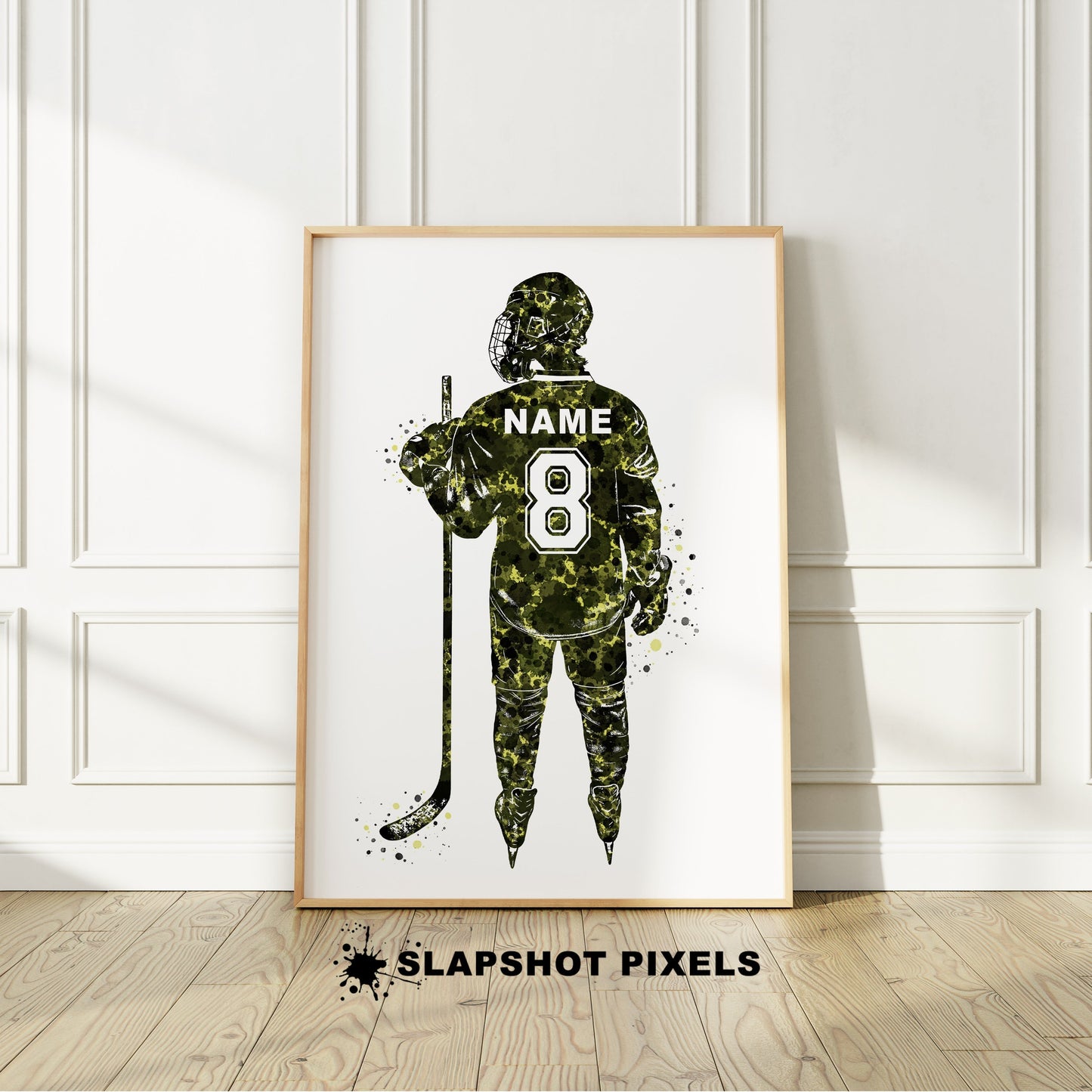 Personalized hockey poster showing back of hockey player with custom name and number on the hockey jersey. Designed in watercolor splatters. Perfect hockey gifts for boys, hockey team gifts, hockey coach gift, hockey wall art décor in a hockey bedroom and birthday gifts for hockey players.