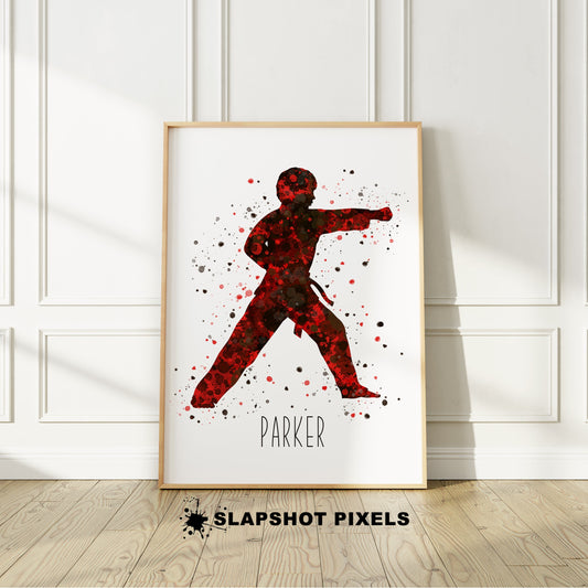 Personalized karate poster showing boy in a punch stance with name under the karate boy. Designed in watercolor splatters. Perfect karate gifts for boys, karate and judo prints, martial arts gifts, tae kwon do gifts, karate wall art décor in a karate bedroom and birthday gifts for karate boys.