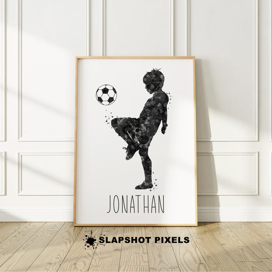 Personalized soccer poster showing little boy soccer player bouncing soccer ball on his knee with custom name under player. Designed in yellow and black watercolor splatters. Perfect soccer gifts for boys, soccer team gifts, soccer coach gift, soccer wall art décor, football prints and soccer bedroom.