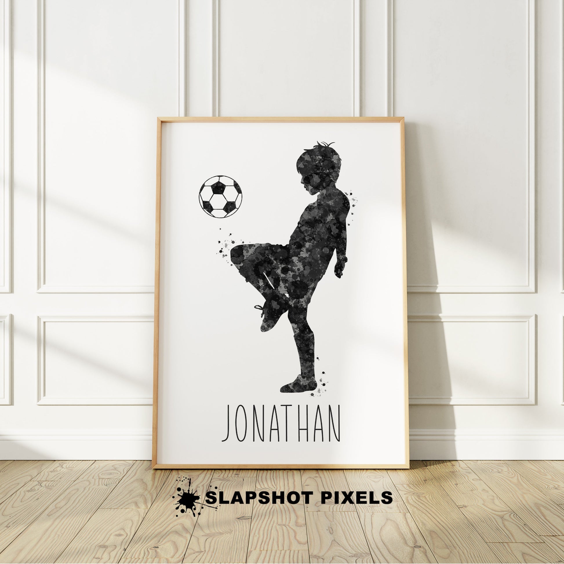 Personalized soccer poster showing little boy soccer player bouncing soccer ball on his knee with custom name under player. Designed in yellow and black watercolor splatters. Perfect soccer gifts for boys, soccer team gifts, soccer coach gift, soccer wall art décor, football prints and soccer bedroom.